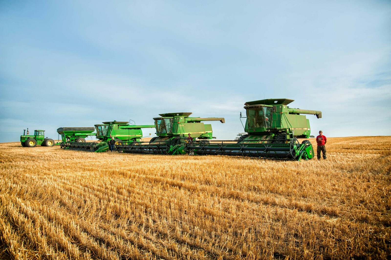 Farmers at a field meeting discussing federal agriculture policy