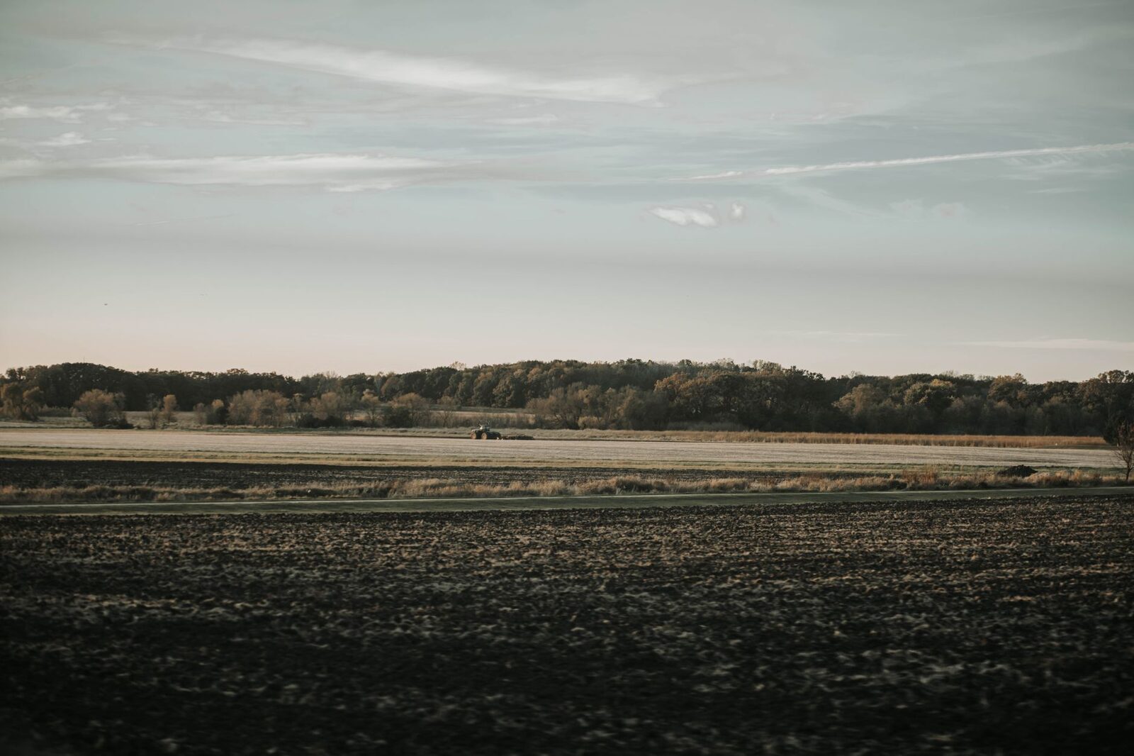 Aerial view of Illinois farmland at sunset during harvest season