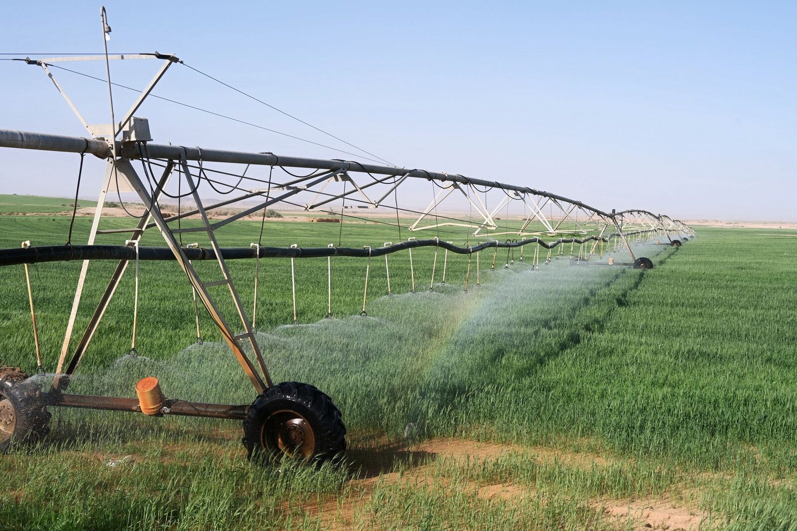 A center pivot irrigation system over farmland in the High Plains